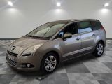 a picture of a silver minivan parked in a garage