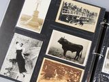 a black and white photo of a book with pictures of people and animals