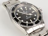 an image of a watch on a bracelet on a white surface
