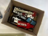 a box of assorted toys sitting on a table