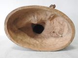 a vase that has a hole in the middle of it