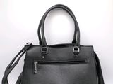 black leather handbag on a white background with a white background