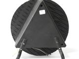 underside view of a black circular object on a white background