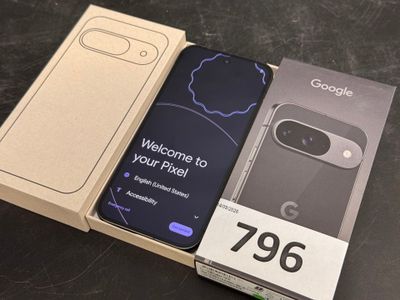 an open box with a phone inside of it sitting on a table