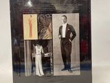 a picture of a book with a picture of a man in a tuxedo and a woman in a dress