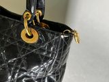 a black purse that is sitting on a table