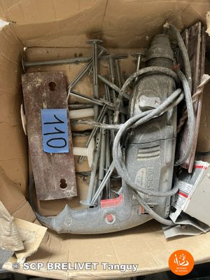 a cardboard box full of assorted electrical equipment