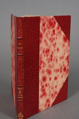 a red and white book with red spots on it