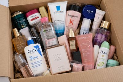 a cardboard box filled with many different types of skin care products