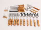 many different types of silverware and forks and spoons