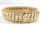 a close up of a bracelet on a white surface