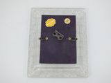 a picture of a picture of a key in a picture frame