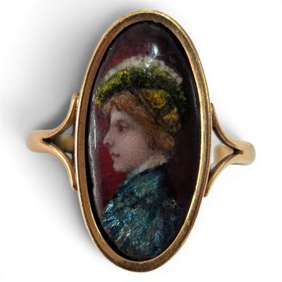 an oval portrait of a woman wearing a green hat and a blue dress
