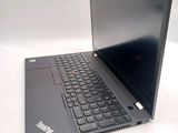 a laptop computer sitting on a white surface with a black keyboard