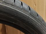 the tire of a motorcycle is sitting on a cardboard box