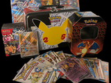 a box of pokemon cards next to a case of cards