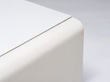 close up of a white table with a white surface and a white table top