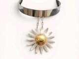 silver and gold sunflower choke necklace with a gold plated center