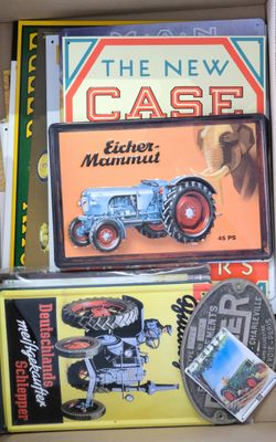 a box full of books and a toy tractor in it