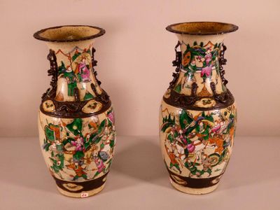 two vases that are sitting on a table
