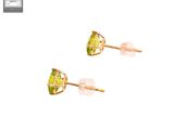a pair of earrings with green crystals on a white background