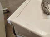 a washing machine that is sitting on a pallet