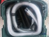 a green box with a bunch of hoses inside of it