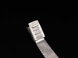 a silver watch with a metal band on a black background