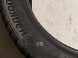 a close up of a tire on the ground next to another tire