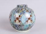 a vase that has a blue and brown design on it