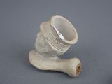 a white vase that is sitting on a table