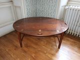 a wooden table that is sitting on a hard wood floor
