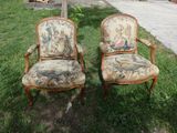 two chairs that are sitting in the grass