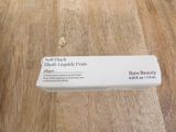 a box of soap sitting on a wooden table