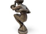 an image of a statue of a man playing a trumpet
