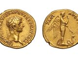 a gold coin with an image of a woman holding a sword