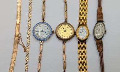 several different types of watches are displayed on a white surface
