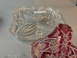 three glass dishes sitting on a white table