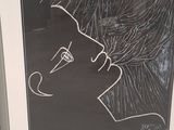 a black and white drawing of a woman on a blackboard