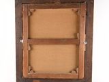 an old wooden picture frame with a picture hanging on the wall