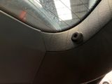 a close up of a car ' s interior with a window open