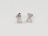 a pair of diamond earrings on a white background