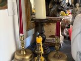 a table with candles and a mirror on it