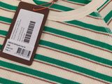 a close up of a striped shirt with a tag on it