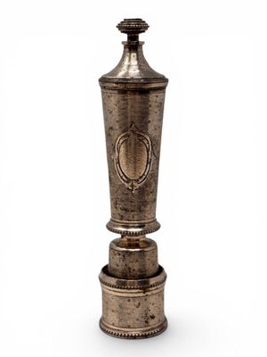 an antique silver vase on a white background with a white background