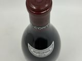 a bottle of wine that is sitting on a table