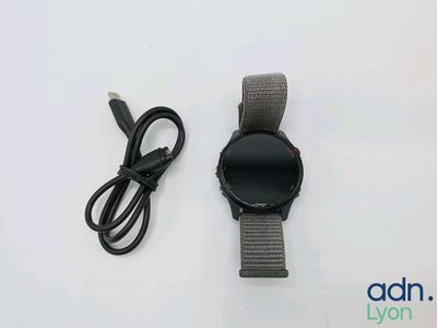 a smart watch and a charger on the table