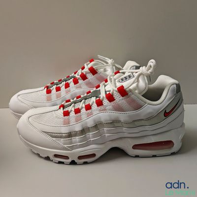the nike air max 95 is a white, red and grey sneaker