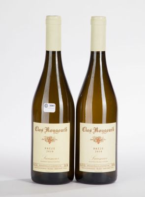 pair of two bottles of white wine sitting next to each other