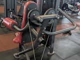 a gym room with a row of machines in it